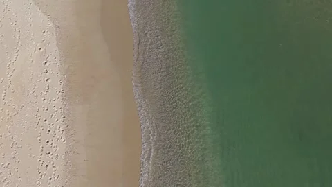 Aerial drone top view of sandy beach and turquoise sea Stock Footage 324529602