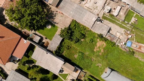 Aerial drone top view slow motion footage of houses in the village. Stock Footage 113864935