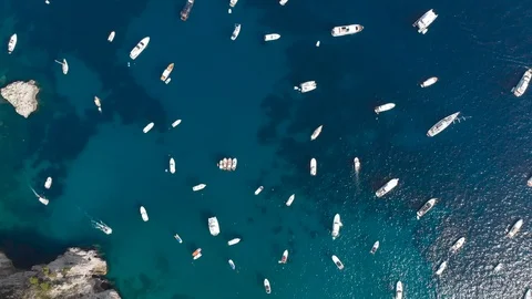 Aerial drone top view tracking shot of luxury boats berth in seawater Stock Footage 113698944