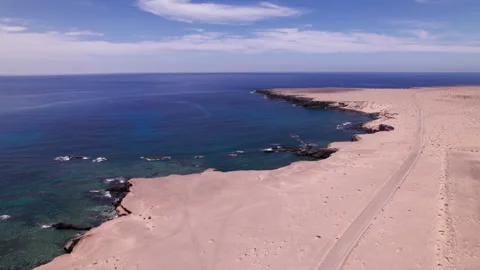Aerial drone toward cliffs and ocean near Playa de Soledad Stock Footage 309852031