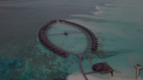 Aerial Drone Track Left at Sunset to show Jacuzzi Water Villas 스톡 동영상 80944599