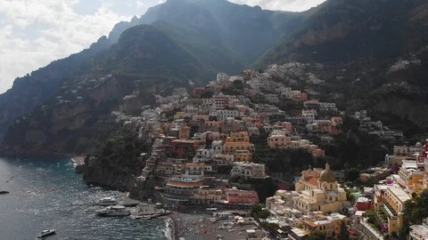Aerial drone tracking flying over from sea to colorful buildings of Positano Stock Footage 113702545