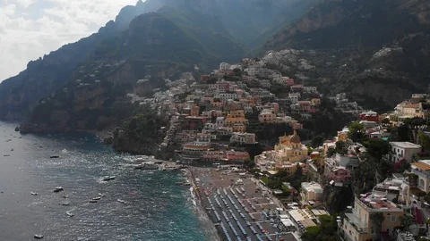 Aerial drone tracking flying over from sea to colorful buildings of Positano Stock Footage 113703193