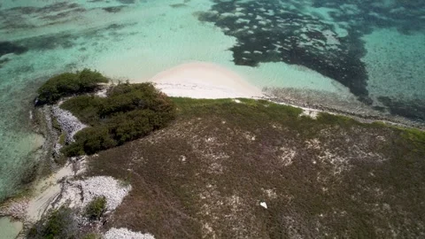 Aerial Drone Tracking Over Caribbean Island with Queen Conch Shell Mounds and Stock Footage 340836328