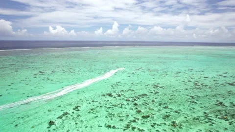 Aerial Drone Tracking Shot of Fast Jetskis in Tropical Turquoise Lagoon 10Bit Stock Footage 171972276