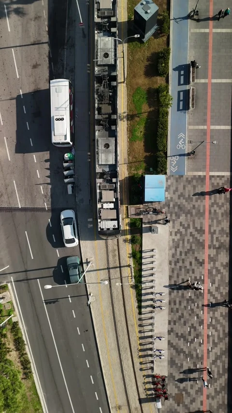 Aerial Drone Tracking Shot of a Tram Moving Through the City Stock Footage 340105347