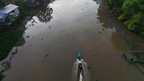 Aerial Drone Tracking Small Motorboat Cruising On River Stock Footage 340454861