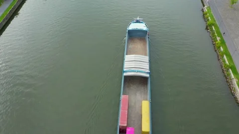 Aerial drone tracking top view of inland cargo ship, sailing In the river Stock Footage 179346831