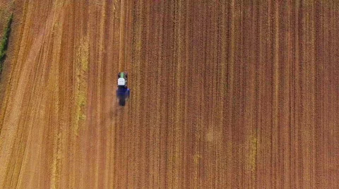 Aerial drone tractor cultivation land agriculture farming field ground texture Stock Footage