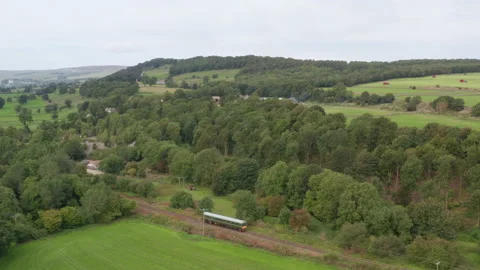 Aerial Drone of train passing through English Countryside, Wensleydale Stock Footage 235469092
