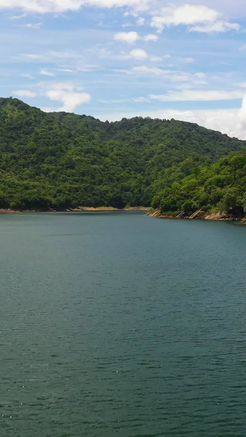 Aerial drone of Tropical mountains and lake. Stock Footage 252185569