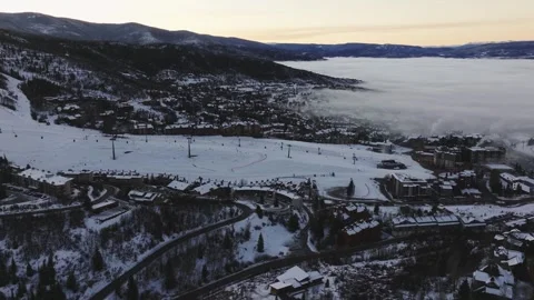 Aerial drone trucking right rotating shot of Steamboat Springs Colorado at Vidéo 347881553