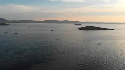 Aerial drone uplifting over two small island in open sea 스톡 동영상 95146293