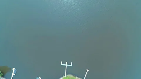 Aerial Drone Vertical 7ft to 400ft Over Water 4K Color Corrected Video stock 75736667
