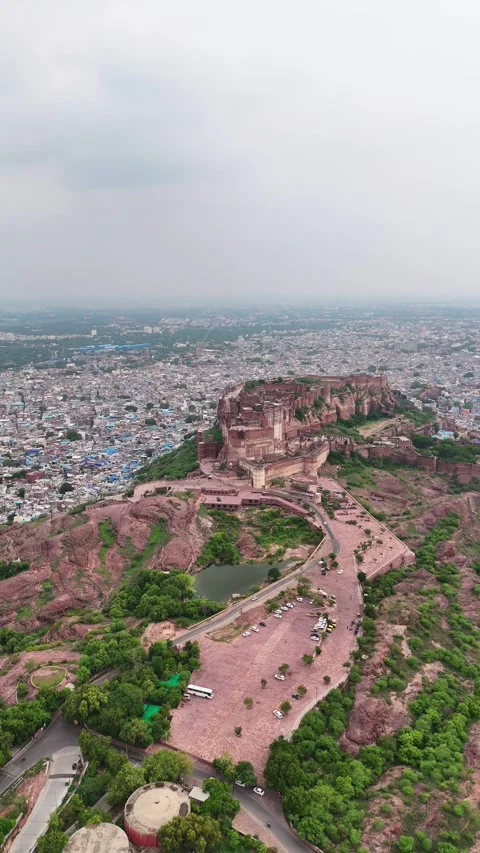 Aerial drone vertical pan across Jodhpur skyline and fort Stock Footage 310659859