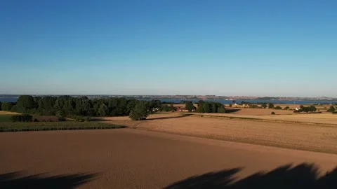 Aerial drone video from above of fields and houses Swedish island Hven Stock Footage 237273396