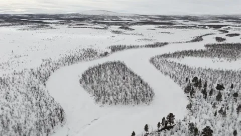 Aerial drone video capturing the expansive snowy landscape near Kiruna, Sweden. Stock Footage 330376768