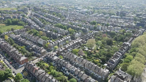 Aerial drone video of dense rows of British terraced houses. Stock Footage 304261095