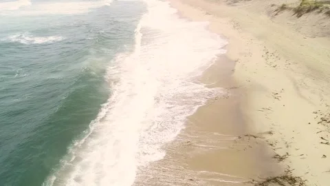 Aerial drone video of a empty beach on a cloudy day in summer 스톡 동영상 278204732