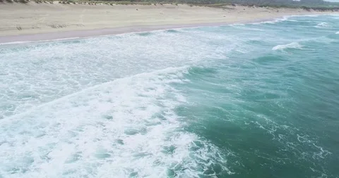 Aerial drone video of an empty beach at sunrise on a cloudy summer day. Bac.. Stock-Footage 294389843