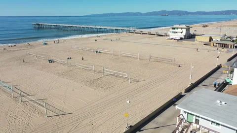 Aerial Drone video of empty Volleyball Courts and the Hermosa Pier Video stock 323765178