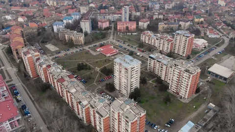 Aerial drone video flying over town buildings.  4K UHD Stock Footage 97765722