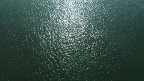 Aerial drone video hovering high above the Atlantic Ocean. Calm deep-green water Stock Footage 319554008