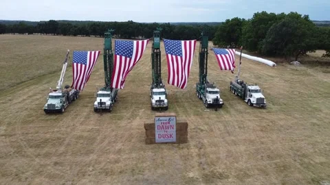 Aerial Drone Video of Large Flags Waving in the WInd on the 4th of July Vídeo Stock 245361724