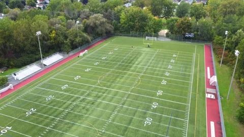 Aerial drone video moving forward slowly and filming down over the football.. Stock-Footage 256063367