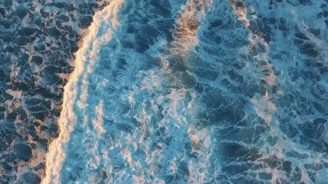 Aerial drone video of ocean waves crashing on shore. Tracking shot of sea waves Stock Footage 73055233
