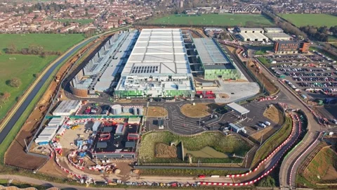 Aerial drone video over a large data centre construction site in England Stock Footage 330135929