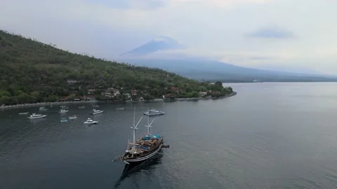 Aerial Drone Video of Pinisi Boat in Jemeluk Bay Bali Stock Footage