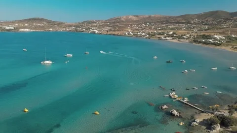 Aerial drone video of sandy beach blue sea water, clear blue sky Paros island 스톡 동영상 139159366
