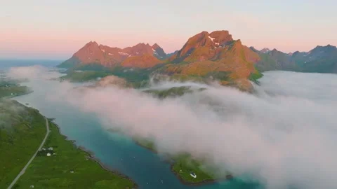 Aerial drone video of sunset over Lofoten mountains and fjords in Norway. Stock Footage 337345672