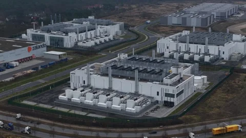Aerial drone video of the Vantage Data Centers Berlin I campus large-scale Stock-Footage 325495861