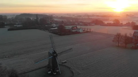 Aerial drone video of a windmill during a frosty sunrise Stock-Footage 168291044