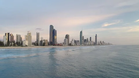 Premium stock video - Looking back at surfers paradise from water with drone