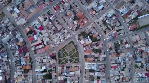 Aerial drone view from above of several houses and a park in the city of Huaraz Stock Footage 164588977