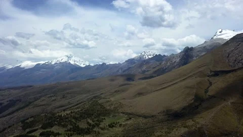 Aerial drone view from above of several snow-capped mountains over the Radian Stock-Footage 164598584