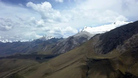 Aerial drone view from above of several snow-capped mountains over the Radian Stock-Footage 164599467