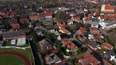 Aerial drone view above small German town with red tile rooftops, church tower Stock Footage 331986464