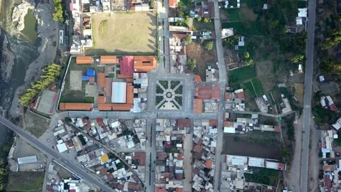 Aerial drone view from above walking to a town square with its soccer field with 库存影片 164593575