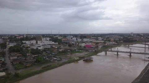 Aerial drone view of Acre river and flag in the amazon. Rio Branco city skyline. Stock Footage 131560564