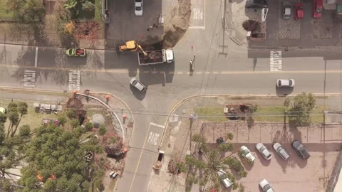 Aerial drone view of active road construction with traffic and pedestrians .. Vídeos de archivo 336198284
