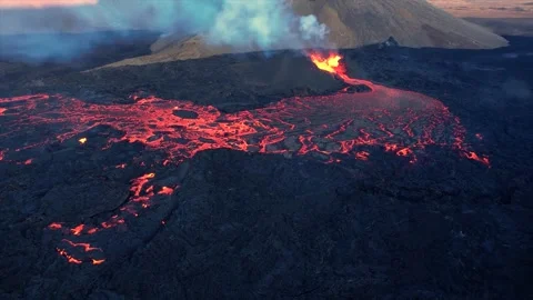 Aerial drone view of active volcano eruption with lava flows Stock Footage 346323636