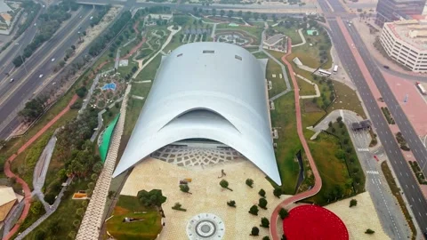 Aerial Drone View of Al Shaheed Park Dome and Urban Landscape in Kuwait City Stock Footage 325845665