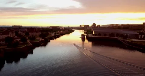 Aerial drone view, along the River Clyde, in Glasgow skyline at sunset. Views Stock Footage 156715080
