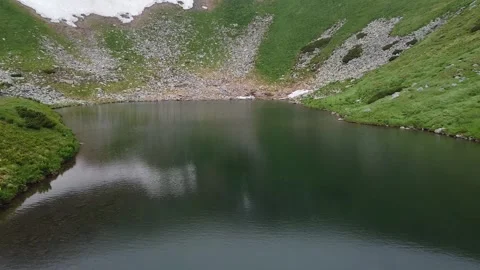 Aerial drone view of alpine mountain lake in Carpathian highlands Stock Footage 339660155
