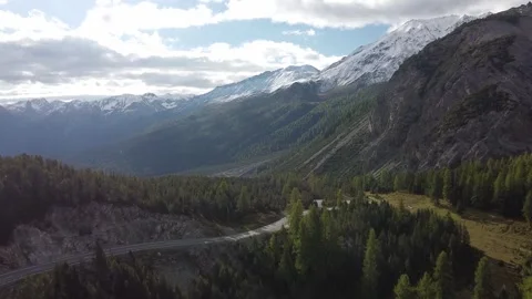 Aerial Drone View of Alpine Road and Autumn Forest in Swiss Alps Stock Footage 327974783