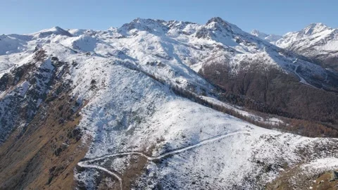 Aerial drone view of the alps under the blue sky on a cold winter day Stock Footage 215873456
